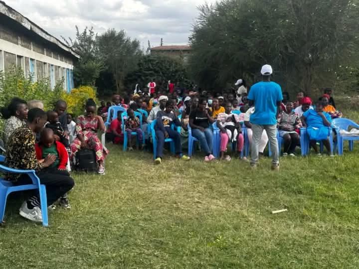 Community members seated in a circle